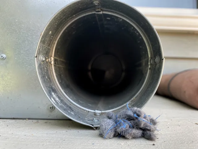 North Tustin Dryer Vent Cleaning technician using specialized equipment to clear severe dryer vent blockage in North Tustin